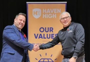 Photo of Mr Duce shaking hands with Rupert Gibson representing Lincolnshire South East School partnership and the RFU 