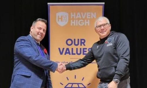 Photo of Mr Duce shaking hands with Rupert Gibson representing Lincolnshire South East School partnership and the RFU 