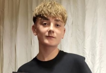 Photo of boy receiving award