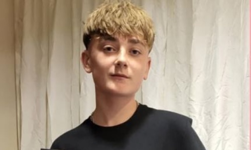 Photo of boy receiving award